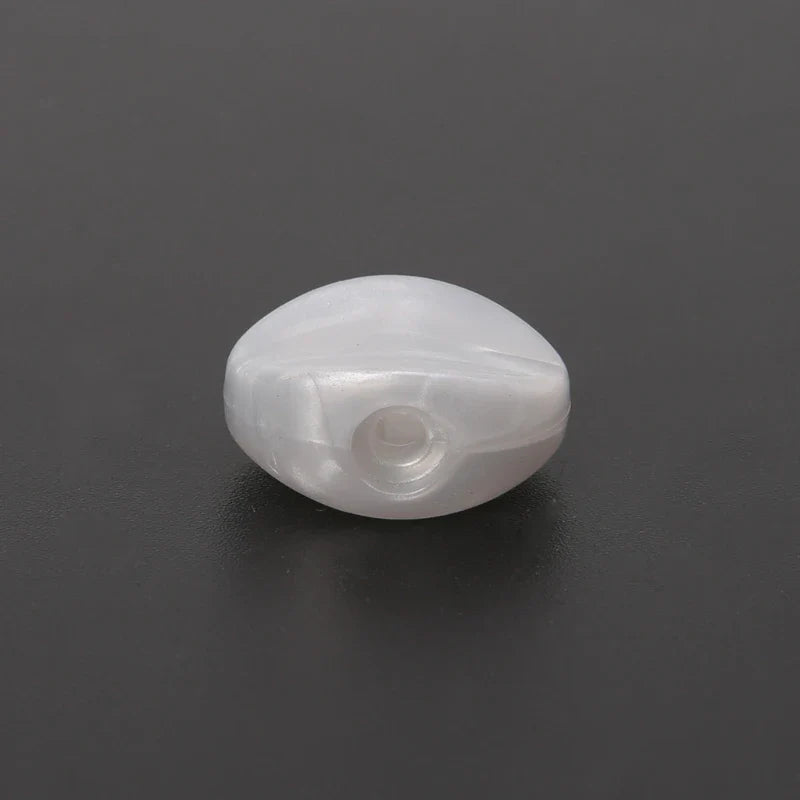 A translucent white oval tuning peg bead with a central hole for 6pcs tuning peg machine heads accessories