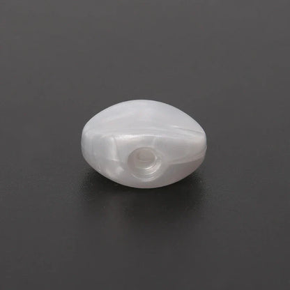 A translucent white oval tuning peg bead with a central hole for 6pcs tuning peg machine heads accessories