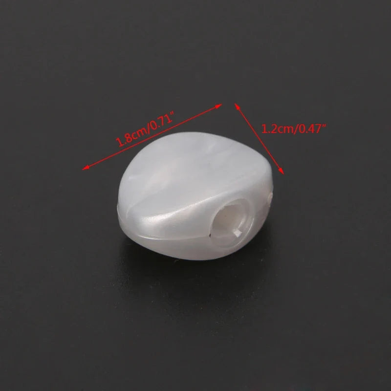 Translucent white plastic tuning peg with smooth rounded shape and central hole for string attachment in 6pcs tuning peg set
