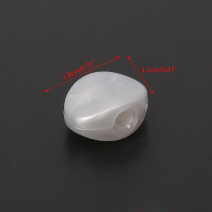Translucent white plastic tuning peg with smooth rounded shape and central hole for string attachment in 6pcs tuning peg set