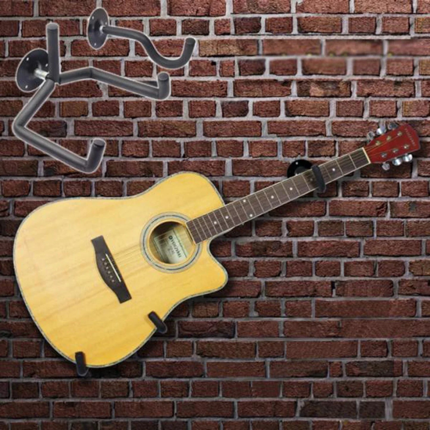 Light-colored acoustic guitar with black hardware on a metal guitar wall mount for music shop exhibition display