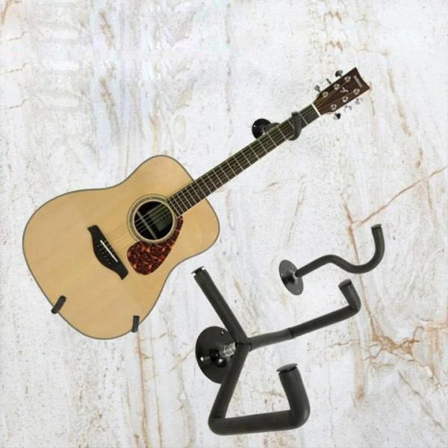 Light-colored acoustic guitar with dark brown fretboard and red tortoiseshell pickguard on guitar wall mount for music shop exhibition