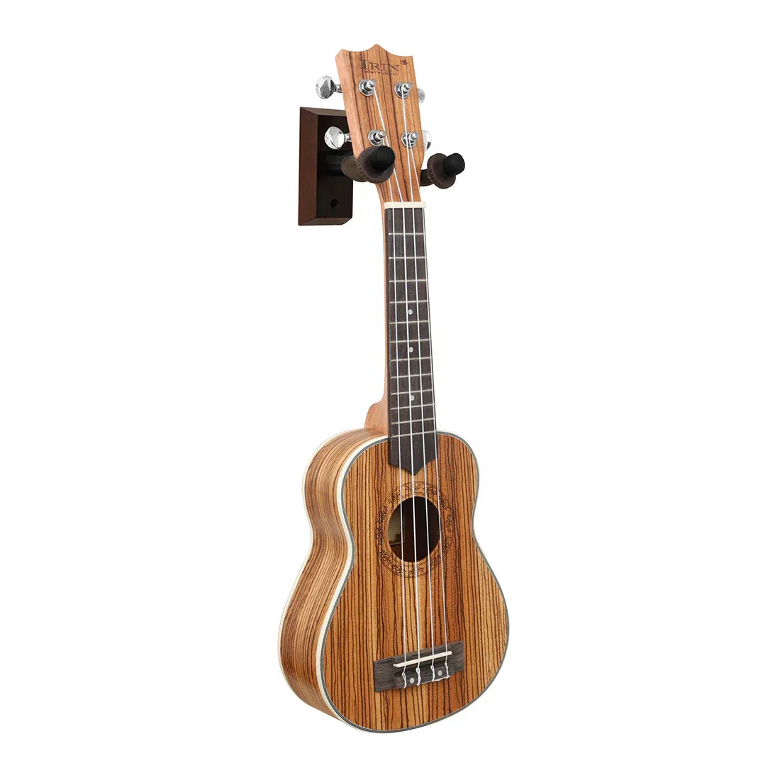 A wooden ukulele with zebra wood finish and black fretboard mounted on a walnut guitar wall mount bracket