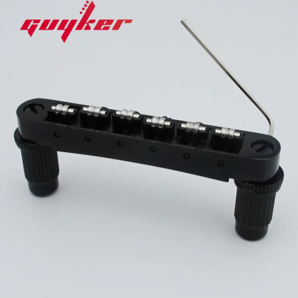 Black guyker tune-o-matic roller saddle guitar bridge with six silver tuning pegs and textured adjustment knobs for lp sg guitars