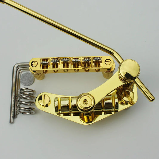Gold-finished guyker tune-o-matic roller bridge with six tuning pegs and matching stop bar tailpiece tremolo for lp sg guitar