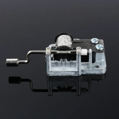 Silver-toned metal hand crank music box diy craft mechanism with visible internal gears and crank handle for box musical movement