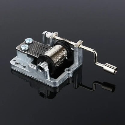 Silver-toned metal hand crank music box with visible diy craft mechanism and box musical movement for girls