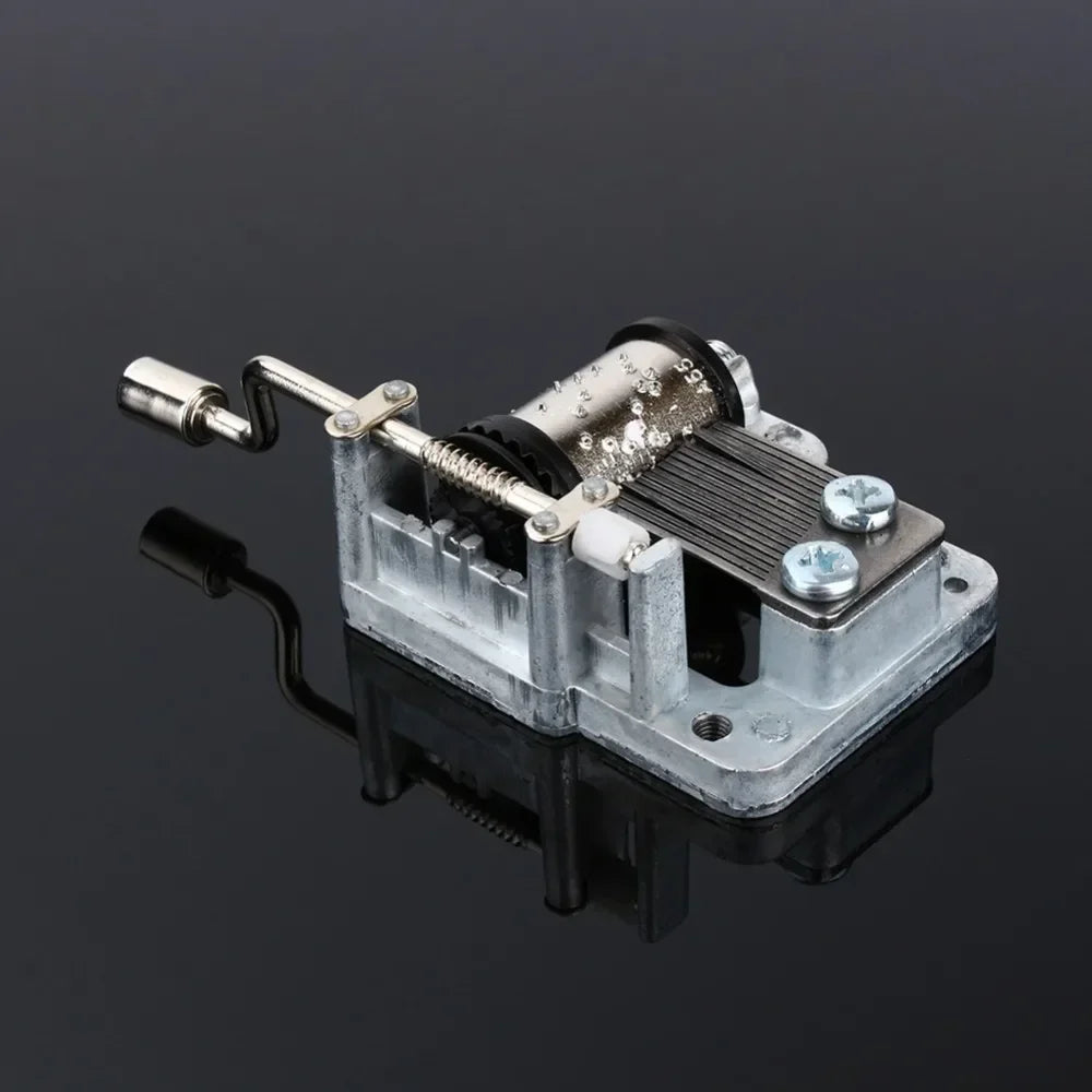 Silver-toned hand crank music box with visible diy craft mechanism and box musical movement for girls with screws