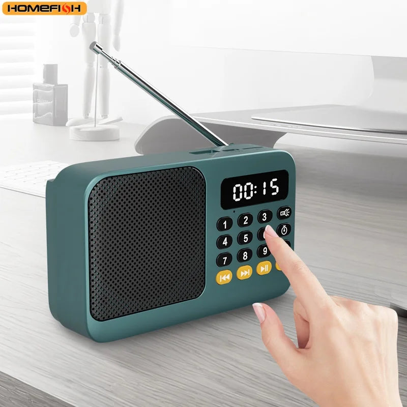 Teal handheld rechargeable digital fm usb mp3 player portable radio with black speaker grille yellow buttons and extendable antenna