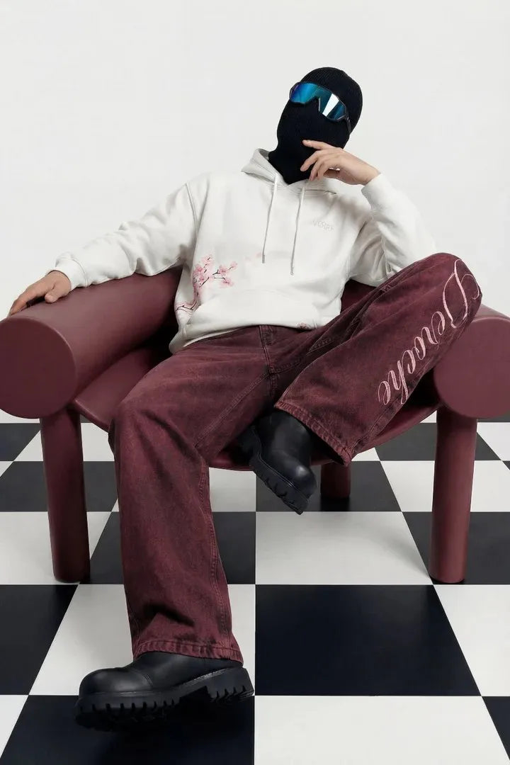 White hoodie with subtle pink cherry blossom embroidery paired with burgundy eyelet belt jeans y2k street casual style
