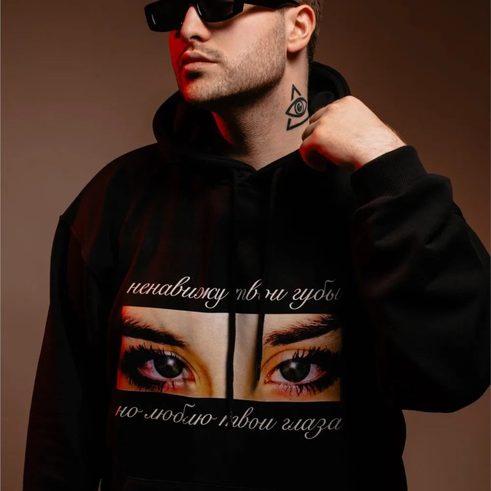 Black hoodie with bold eyes graphic and cyrillic text chest print harajuku oversized streetwear men’s pullover