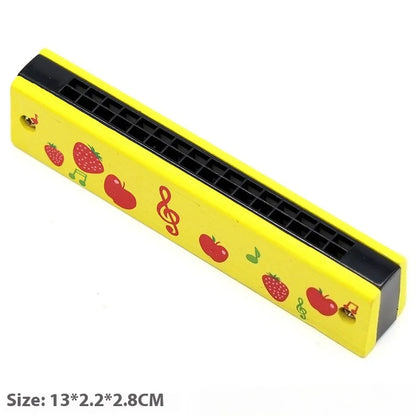 Yellow plastic harmonica toy with red fruit illustrations and musical notes for preschool children beginner education