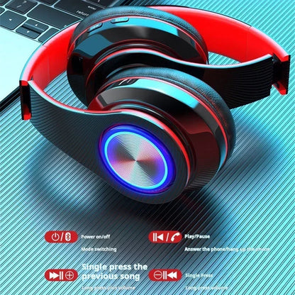 Red and black head-mounted gaming headphones blutooth with glowing blue led lights micro phone colourful surround sound