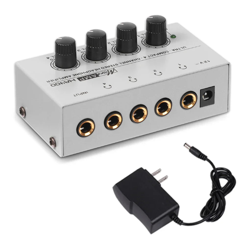 Silver ultra-compact stereo headphone amplifier mocamp ha100 with black knobs and gold-plated 6.35mm jack ports
