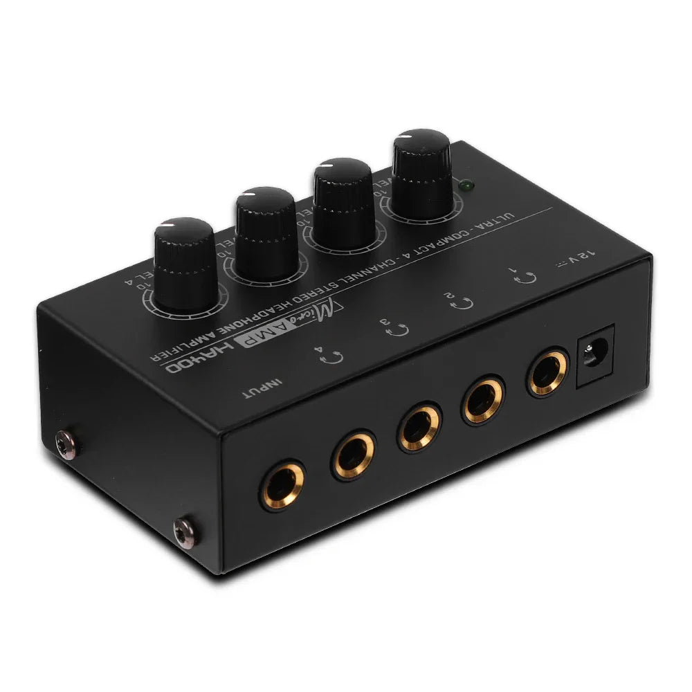 Black ultra-compact stereo headphone amplifier with four knobs and gold 6.35mm jack for audio control and 4 channels