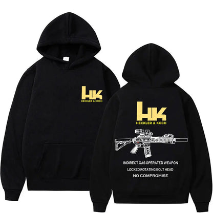 Back of black hoodie featuring bold yellow hk logo and white fashion m4 gun graphic with specifications for autumn pullover streetwear