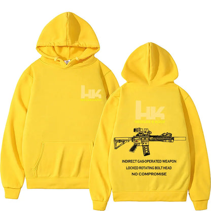 Bright yellow pullover streetwear autumn hoodie featuring black koch hk fashion m4 gun graphic and text design