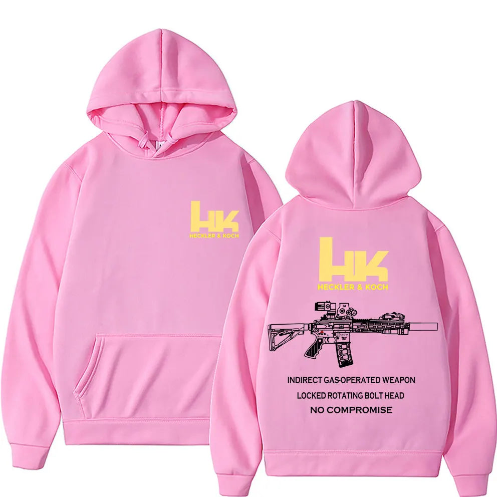 Back view of pink pullover streetwear autumn hoodie featuring yellow heckler and koch hk fashion m4 gun graphic and text