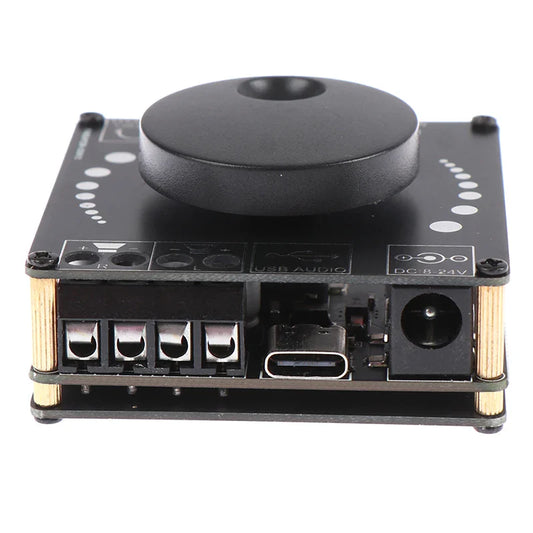 Black rectangular digital amplifier board xy-ap15h with matte knob gold pillars usb-c and dc power inputs visible