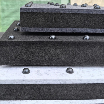 Stacked black foam audio rack isolation pads with metallic dome absorber feet spikes for speaker shock absorber use