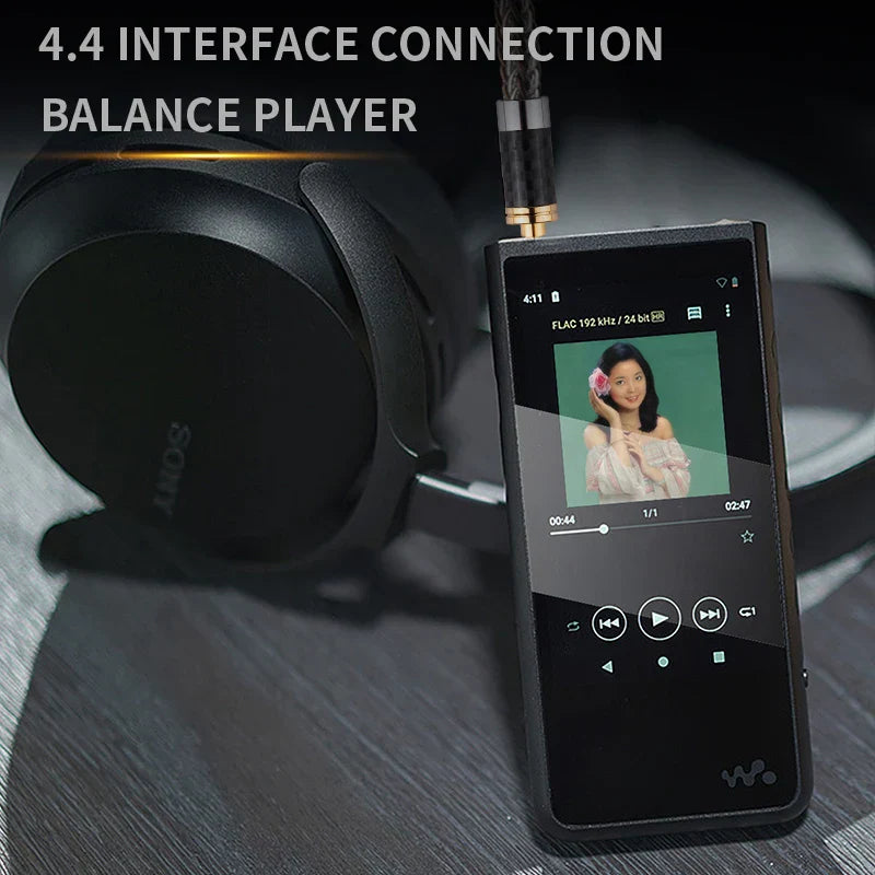 Black rectangular portable music player with touchscreen connected to headphones via 4.4mm high-end 2rca balance audio cable for amplifier audio home theater balance cable