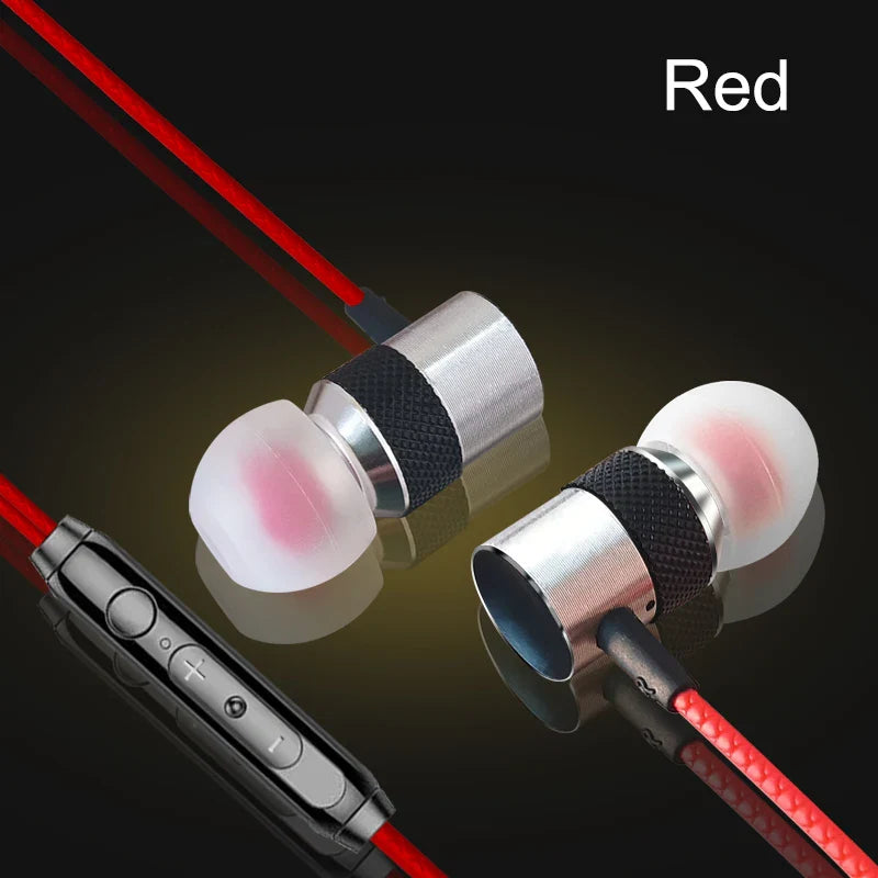 Red wired headphones with silver metallic earpieces black bands and translucent pink silicone tips for phone pc earphone use