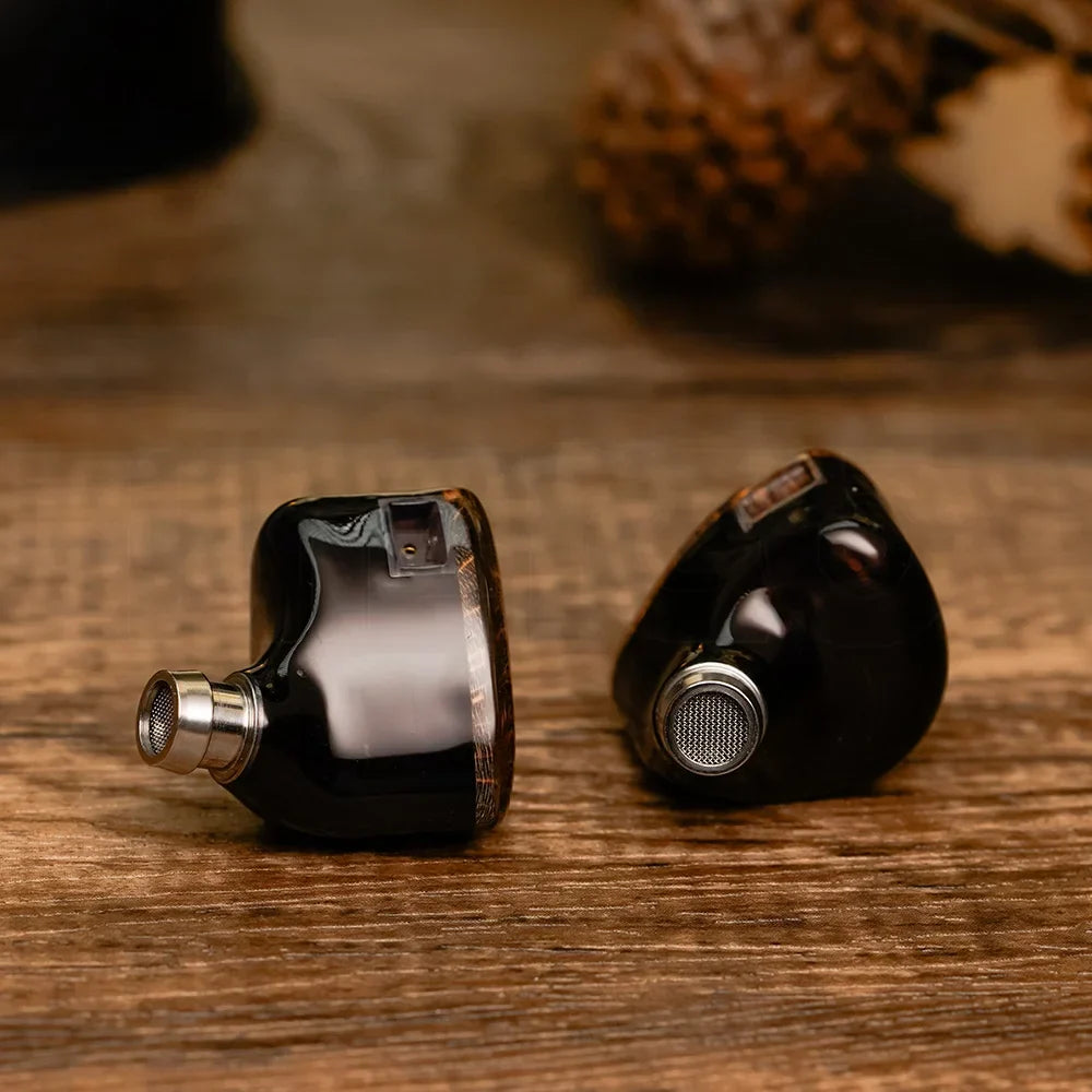 Black glossy dunu davinci hiFiGo in-ear monitors with silver mesh grilles and swappable termination plugs cable