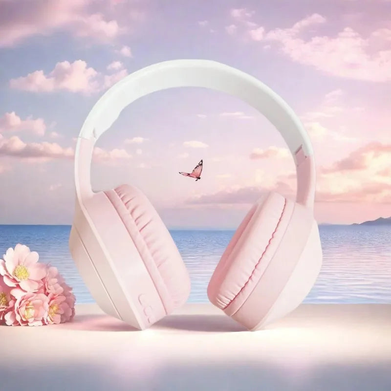 Pastel pink over-ear wireless noise cancelling gaming headphones with soft padded earcups and stereoscopic surround sound