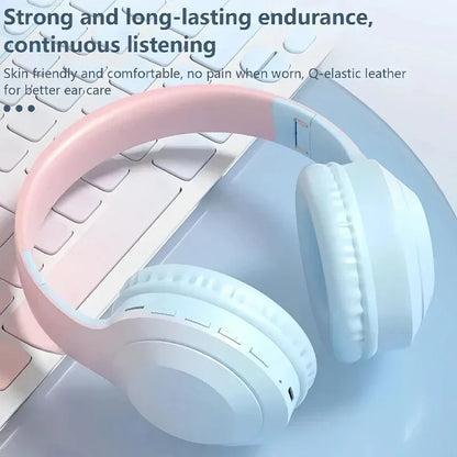 Pastel pink and white over-ear wireless headphones with q-elastic leather earcups featuring noise cancelling gaming and stereoscopic surround sound
