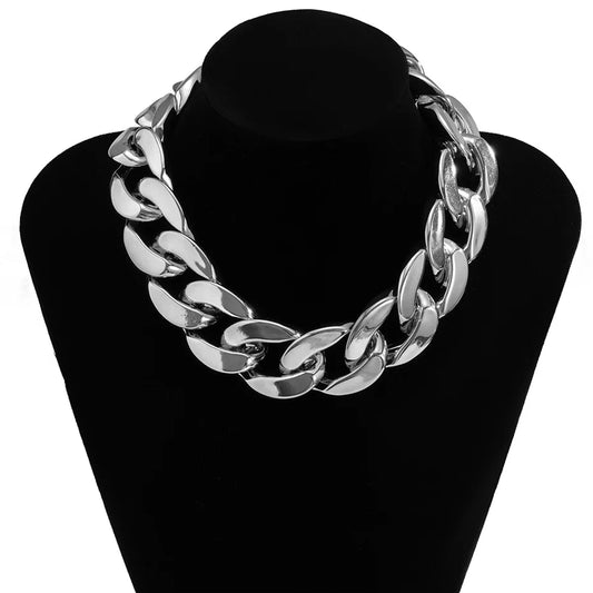 Silver-toned thick curb-link ccb link choker necklace displayed on black mannequin with quality exaggerated acrylic design
