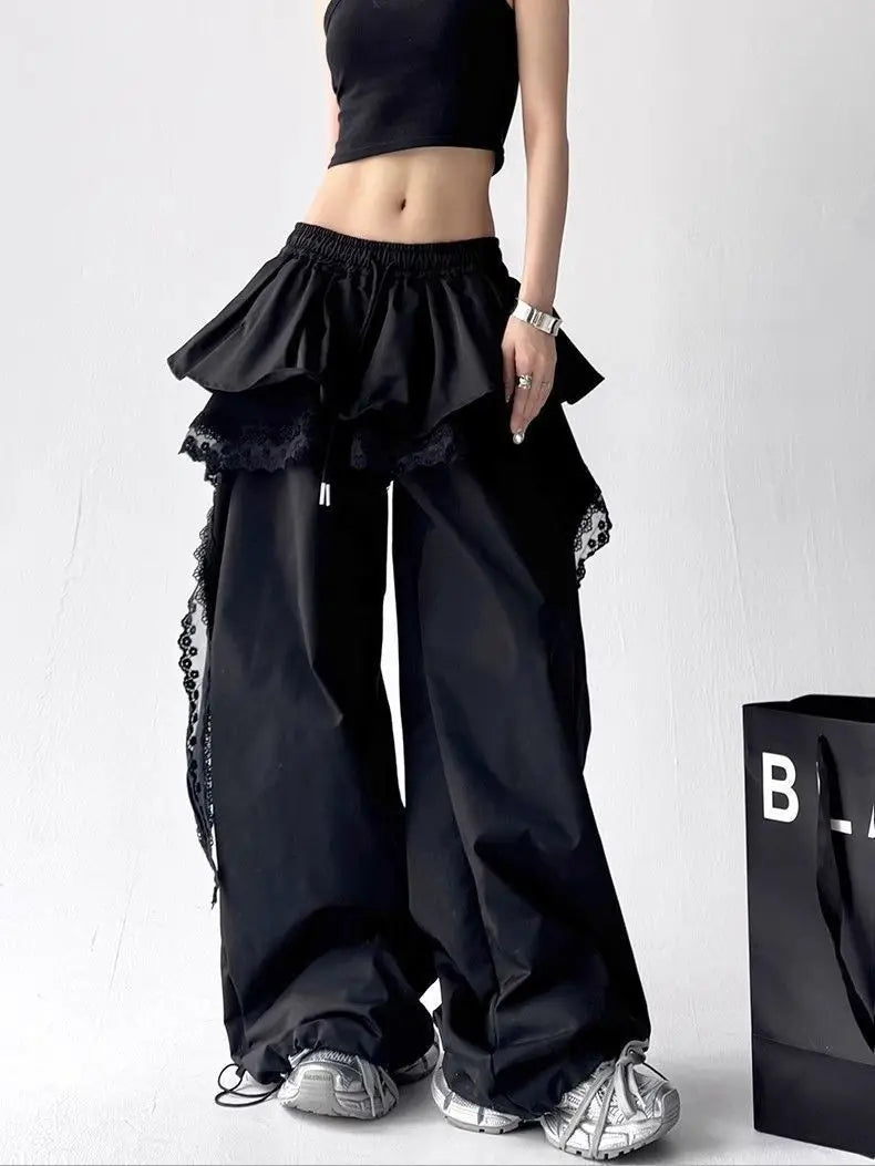 Black lace tiered skirt pants hip hop style with ruffled wide legs, lace trim, and elastic drawstring waist for sexy women girls