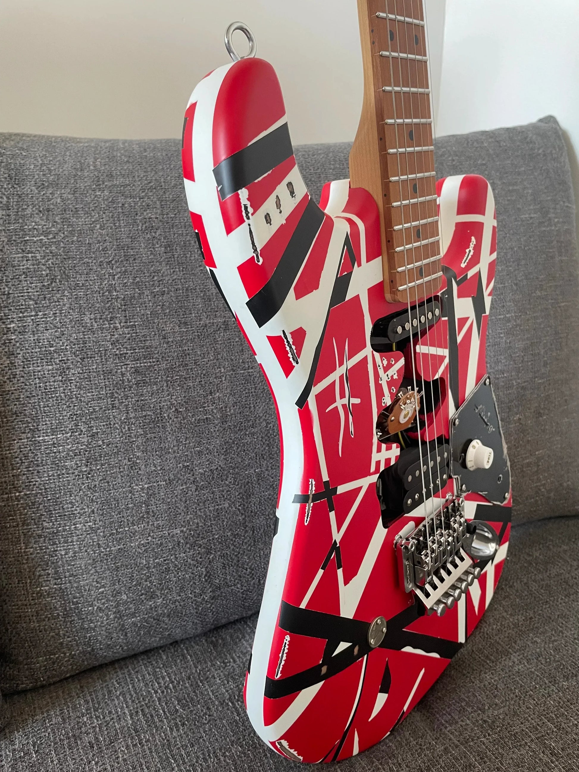 High quality red electric guitar with floyd rose tremolo and tremolo bridge distressed featuring van halen design