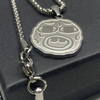 Silver metallic stainless steel hip hop necklace with embossed circular face wearing sunglasses for rapper fan gift
