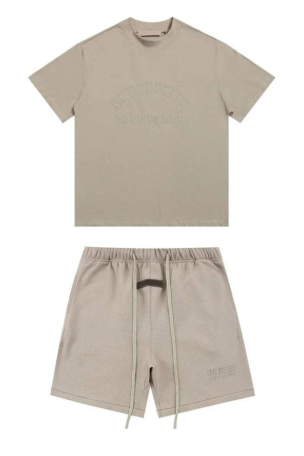 Beige short-sleeved t-shirt with embossed lettering and matching drawstring shorts streetwear featuring brand rubberzied logo in a hiphop shorts sets