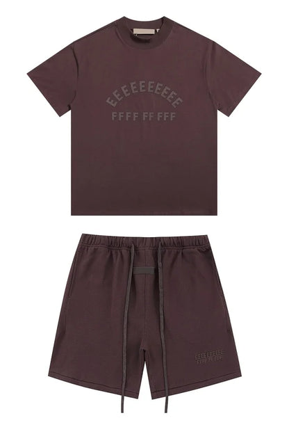 Dark brown short-sleeved t-shirt with subtle arched lettering featuring brand rubberzied logo for shorts sets hiphop streetwear