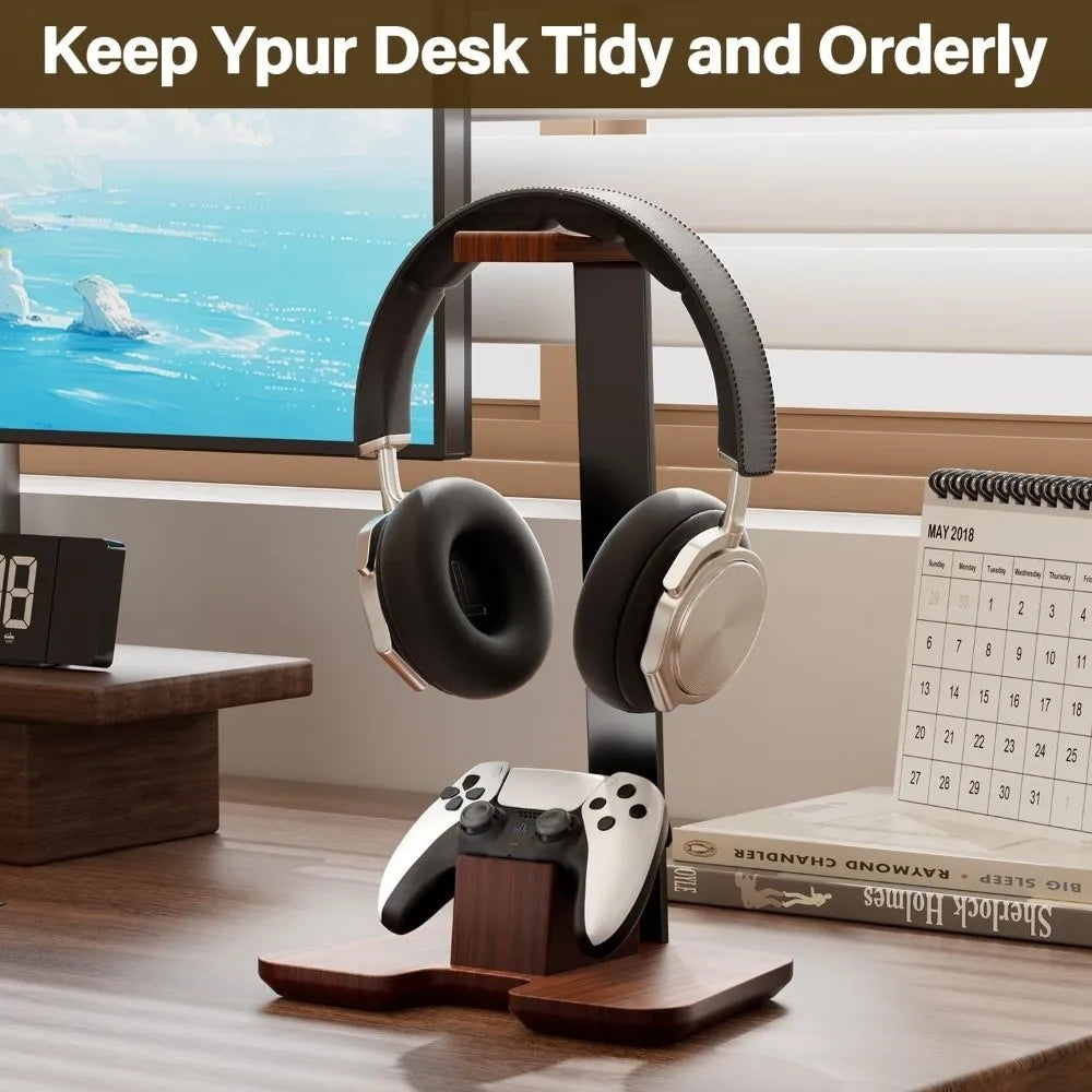 Black and silver gaming headset with padded earcups resting on a creative detachable wooden headphone stand for desk
