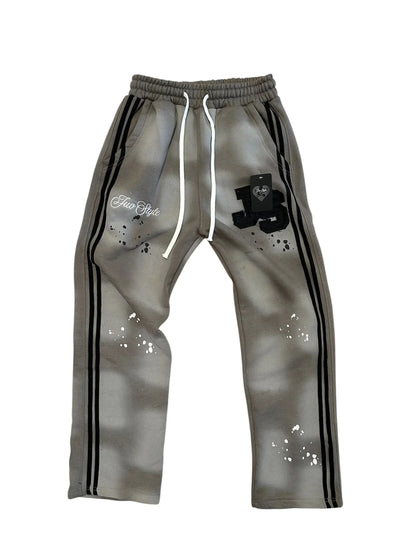 Gray sweatpants with black side stripes white drawstrings and j3 logo splatter paint design in america style trend hip hop cool set
