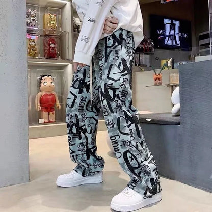 Gray and black high street graffiti printed joggers with relaxed fit for trousers man american casual hip-hop style