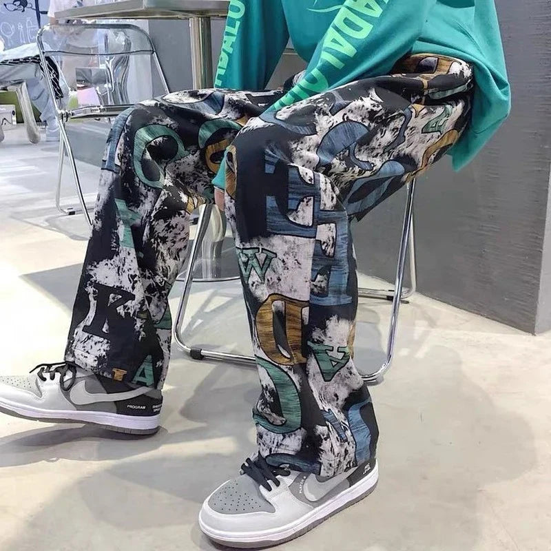 Wide-leg trousers man american with black white and teal high street graffiti print for casual hip-hop style