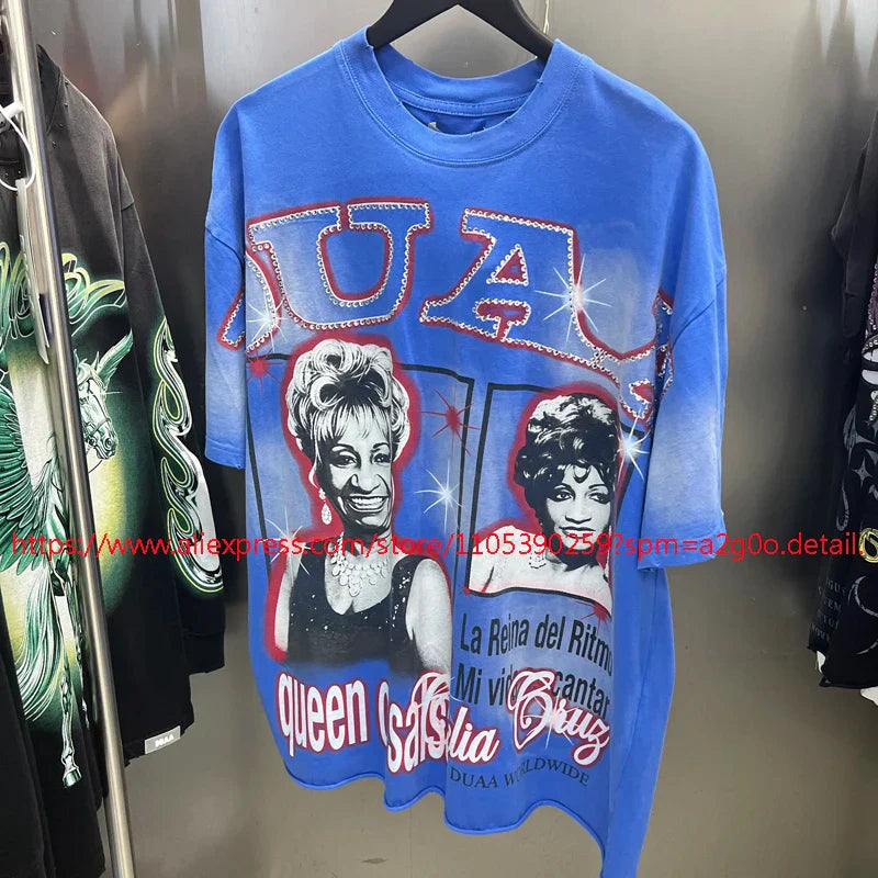 Blue oversized cotton t-shirt with graphic print of two women and rhinestone embellished text designs