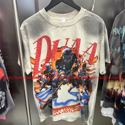 A faded off-white vintage style oversized t-shirt with cracked soldiers graphic and red blue accents from High Street Hip Hop