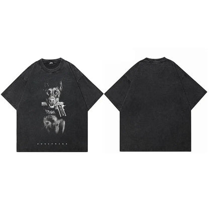 Black vintage washed cotton t-shirt featuring a detailed streetwear doberman dog graphic with pistol and dobermann text