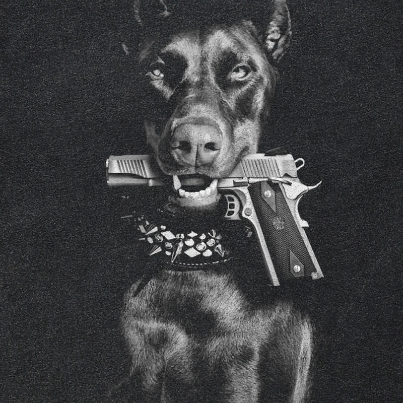 A vintage washed black cotton streetwear doberman dog graphic tee featuring a doberman pinscher with a gun in its mouth