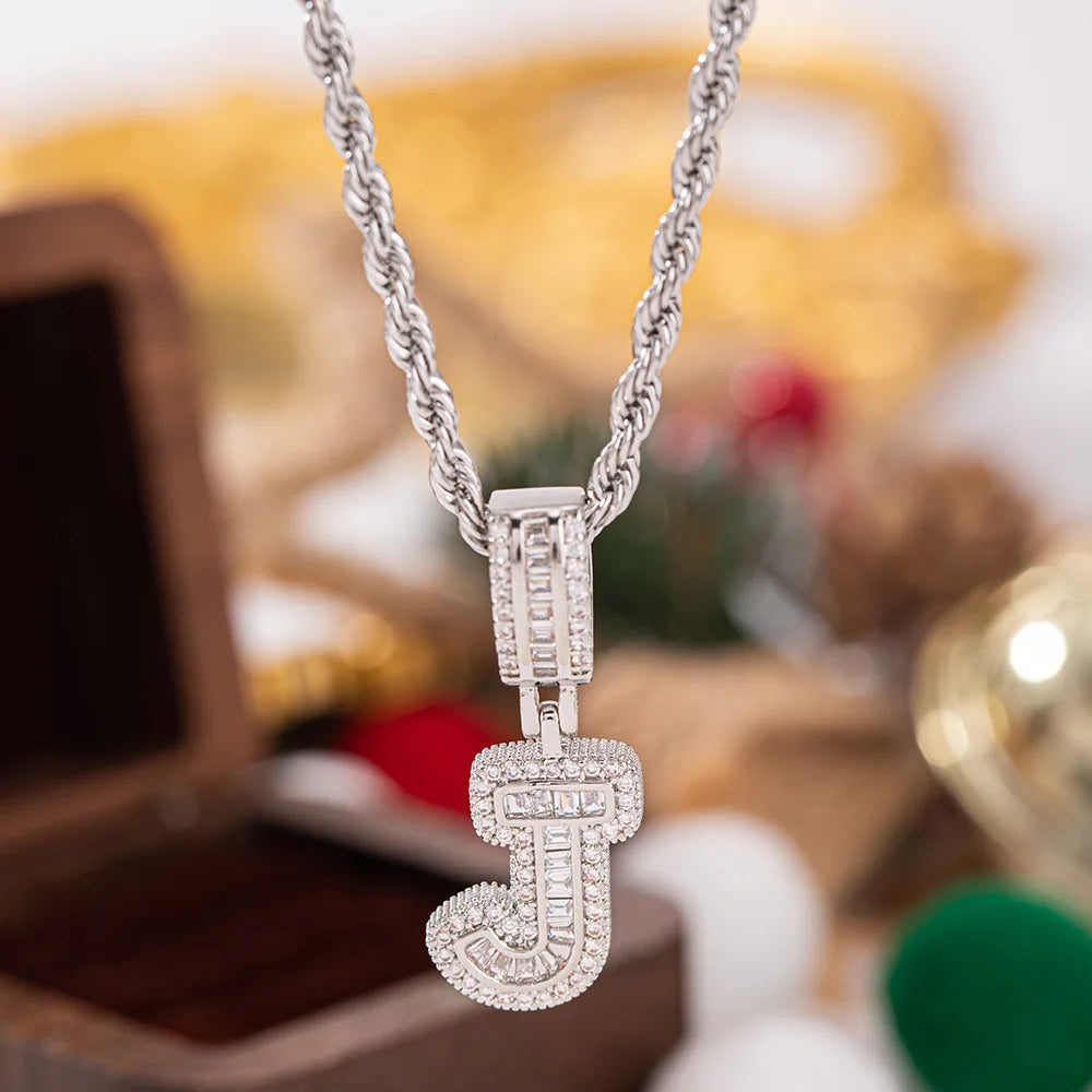 A sparkling silver pendant white zircon necklace with a diamond-encrusted letter j charm on a twisted rope chain