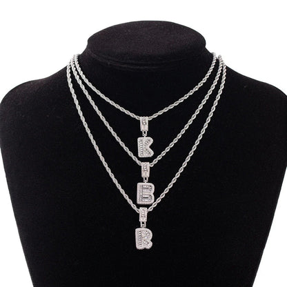 Silver chain wedding jewelry featuring three layered rope-style stone necklaces with pendant white zircon letters k b r