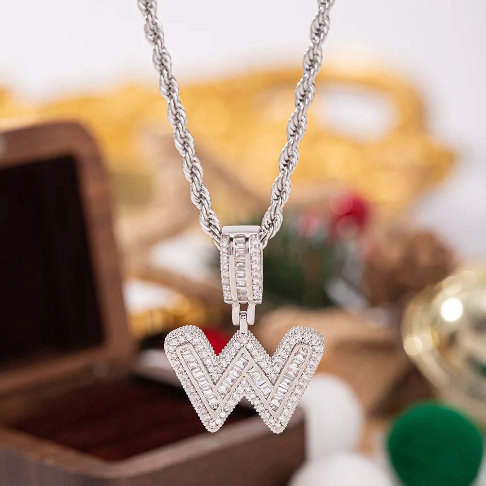 A sparkling silver pendant white zircon w letter necklace with baguette stones and a braided chain for wedding jewelry