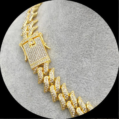 Gold-colored cuban necklace suit with rectangular diamond-encrusted clasp and links paved with rhinestones rapper style