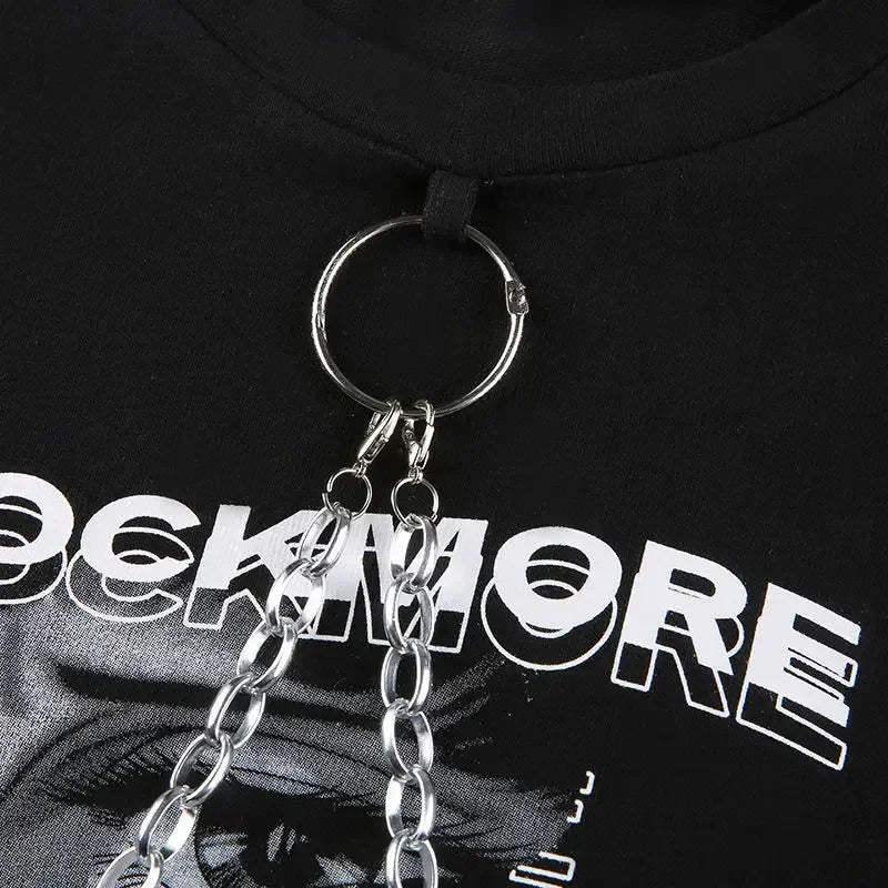 Silver chain keychain with circular ring and interlocking links attached to black harajuke loose print t-shirt female streetwear