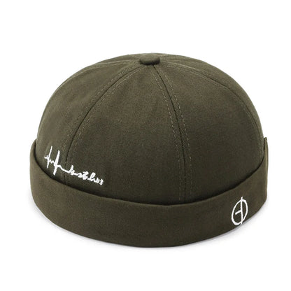 Olive green denim landlord hat docker with white embroidered logo and heartbeat script in rolled edge brimless style