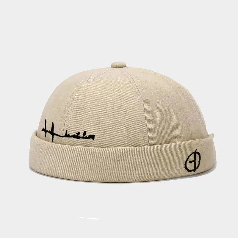 Beige canvas hip hop blue washed cotton landlord cap with black embroidered signature and edge brimless sailor logo on brim